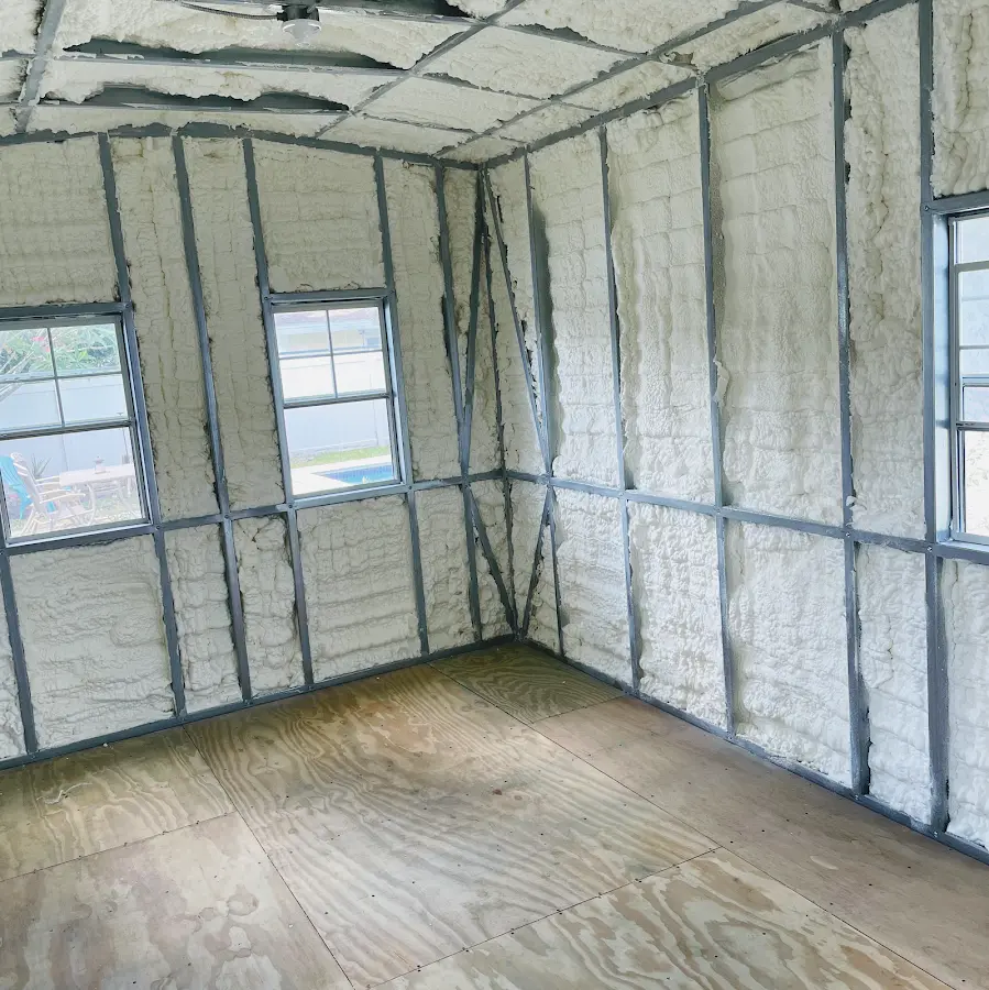 Closed-cell spray foam insulation applied to wall cavities in a residential project in Paramount